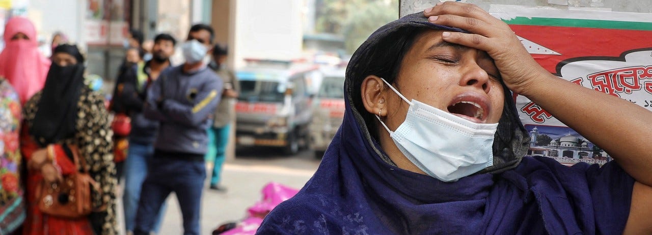 The daughter of a Covid-19 patient cries outside of a hospital