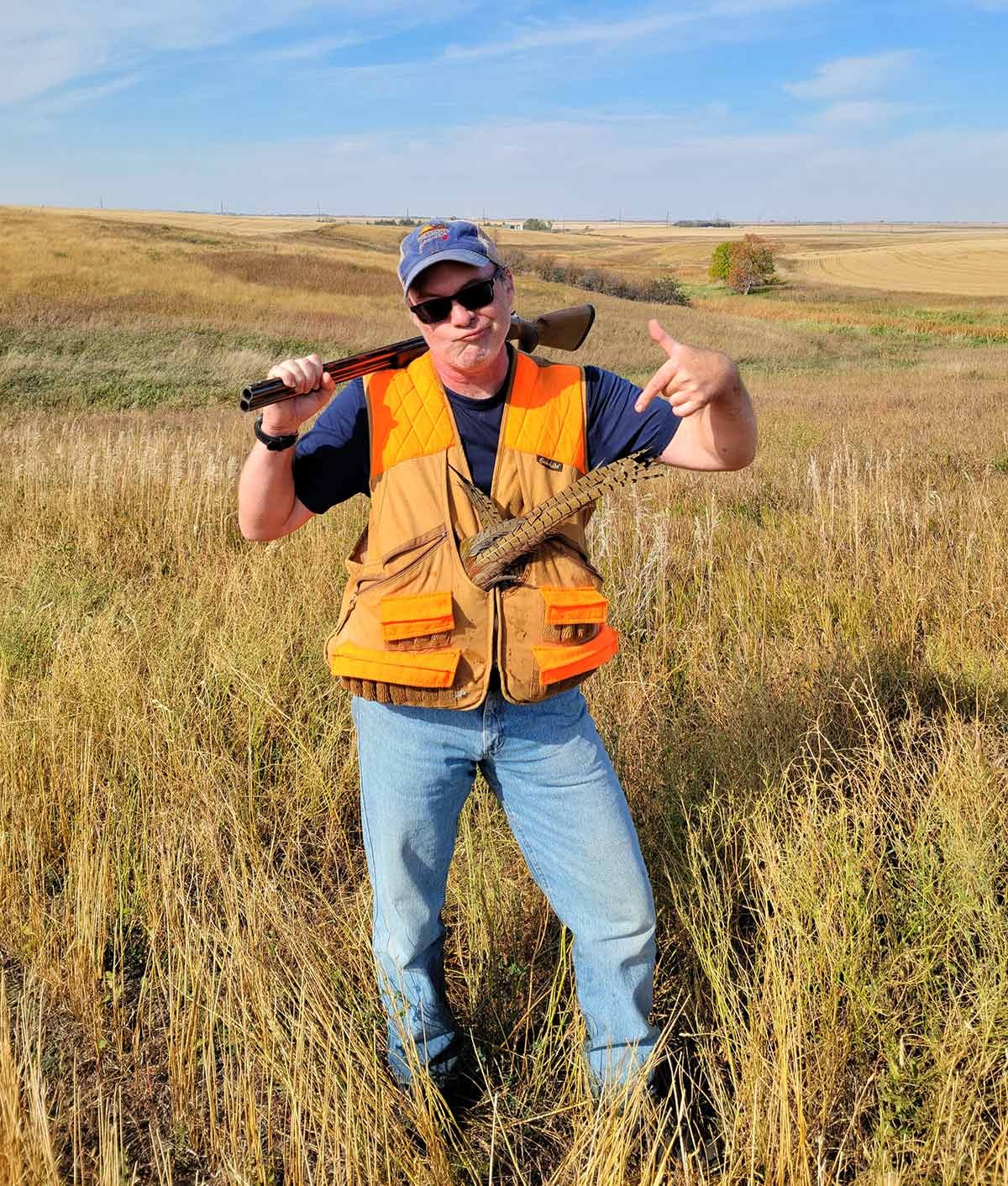 Hank Shaw with pheasants in his game vest. 