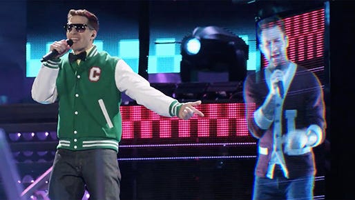 Connor4Real (Andy Samberg) and a hologram of Adam Levine perform "I'm So Humble" in "Popstar: Never Stop Never Stopping," a Universal Pictures comedy directed by Akiva Schaffer and Jorma Taccone.
