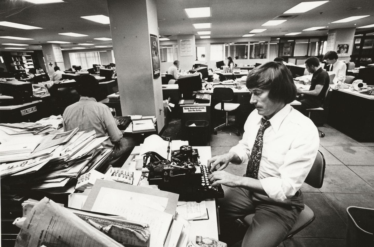 A portrait of writer Jack Thomas at work in the Globe city room in 1979, taken by his colleague Stan Grossfeld.