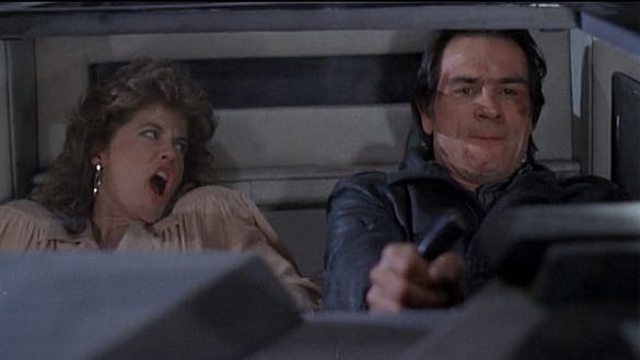 Nina (Linda Hamilton) and Quint (Tommy Lee Jones) put the pedal to the metal in the titular car in "Black Moon Rising," a 1986 New World Pictures release.