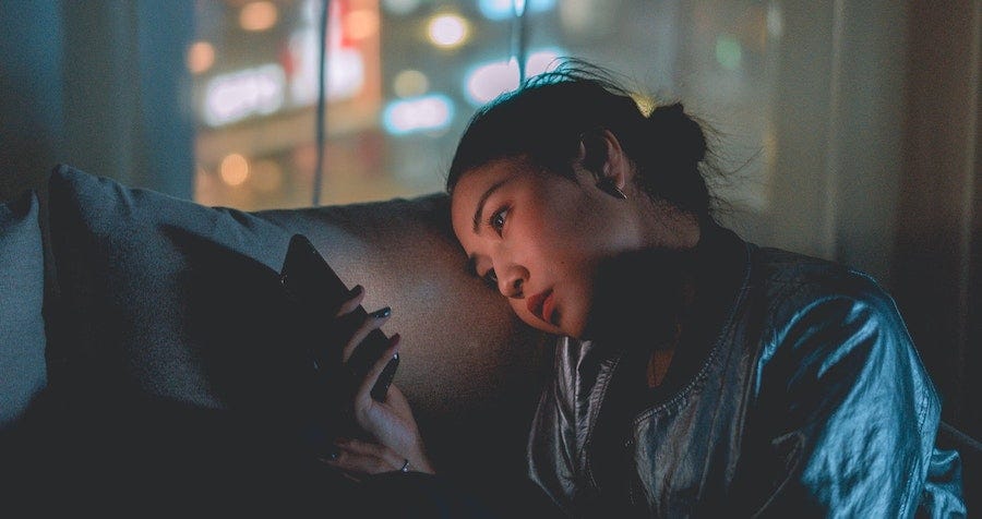 Woman on phone at night