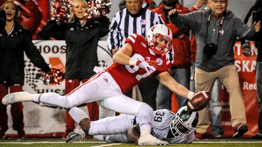 Nebraska wide receiver Brandon Reilly scores the winning touchdown after making a reception and beating Michigan State cornerback Jermaine Edmondson to the goal line Saturday.