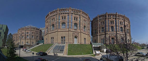 he vienna gasometer on sunny day in vienna, austria - gasometers of vienna in austria stock photos and images