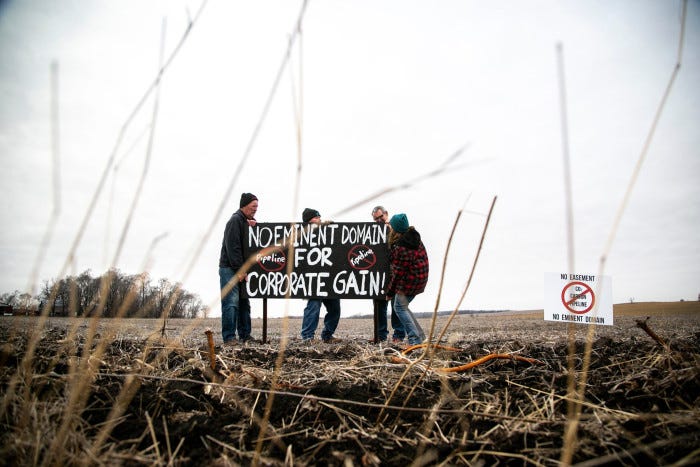 A sign reading ‘No eminent domain for corporate gain!’ in opposition to a carbon capture and sequestration pipeline