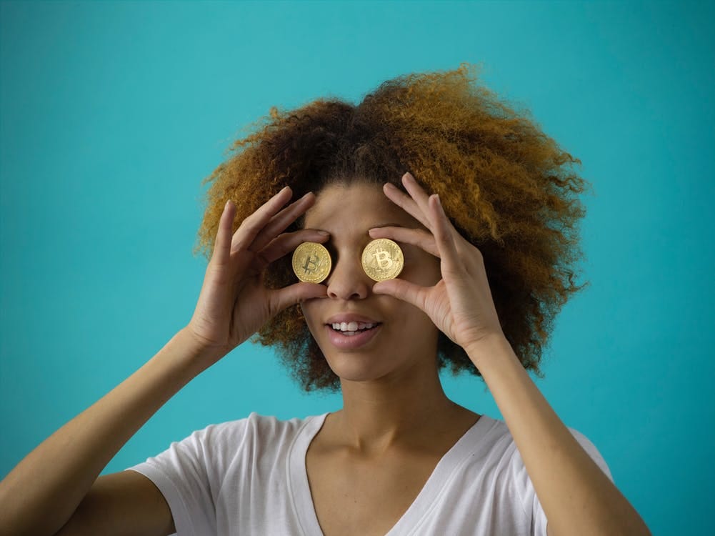 Free Woman Holding Two Coins Stock Photo