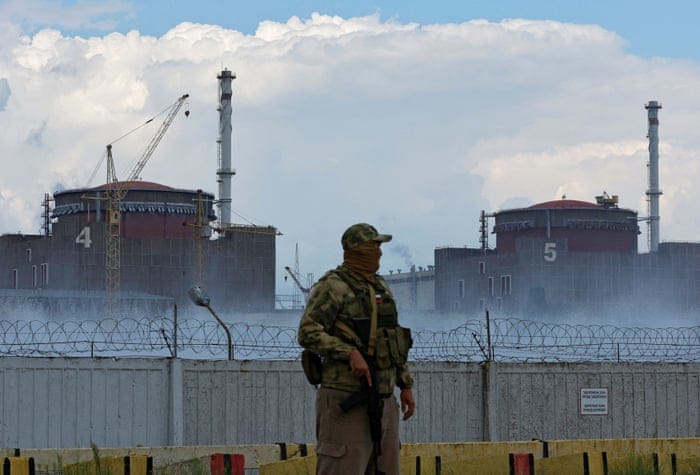 Zaporizhzhia Nuclear Power Plant near EnerhodarA serviceman with a Russian flag on his uniform stands guard near the Zaporizhzhia Nuclear Power Plant in the course of Ukraine-Russia conflict outside the Russian-controlled city of Enerhodar in the Zaporizhzhia region, Ukraine August 4, 2022. REUTERS/Alexander Ermochenko
