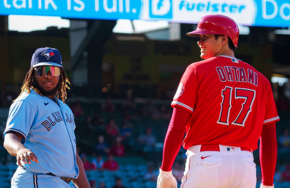 Vladimir Guerrero Jr. and Shohei Ohtani on the field in Anaheim on 5/26/22.