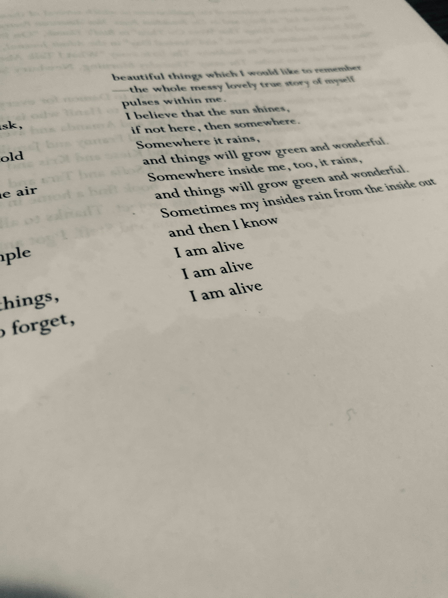 Text on a page reading: Sometimes my insides rain from the inside out and then I know I am alive I am  alive I am alive