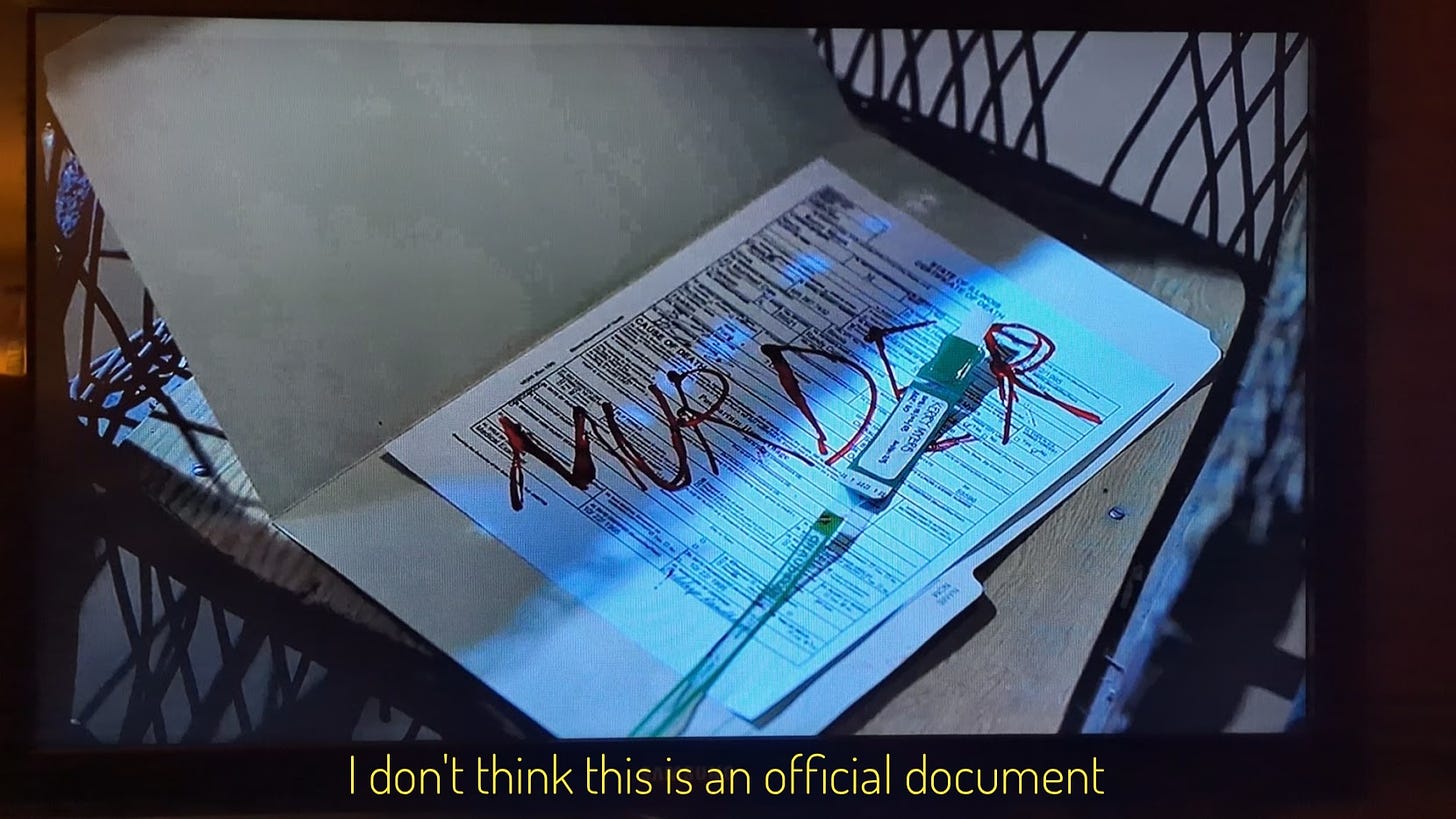 Kerry's death certificate with MURDER scrawled on it, captioned "I don't think this is an official document"