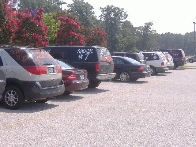 Another shot of some proud parents' cars and SUV's.