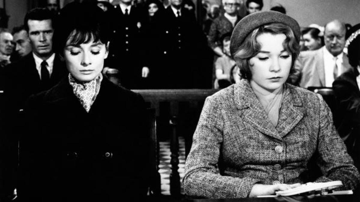 Audrey Hepburn and American actress Shirley MacLaine sitting together in a courtroom in film version of "The Children's Hour." (Credit: Mondadori Portfolio/Getty Images)