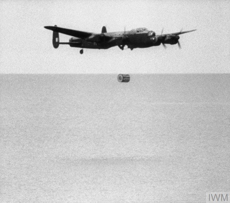 Operation CHASTISE: the attack on the Moehne, Eder and Sorpe Dams by No. 617 Squadron RAF on the night of 16/17 May 1943. No. 617 Squadron practice dropping the 'Upkeep' weapon at Reculver bombing range, Kent. Second launch sequence (3): the bomb falls from the Lancaster as the aircraft begins to climb.