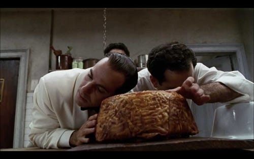 Stanley Tucci (left) and Tony Shalhoub tenderly test their timpano dish in "Big Night," a 1996 comedy-drama from the Samuel Goldwyn Company.