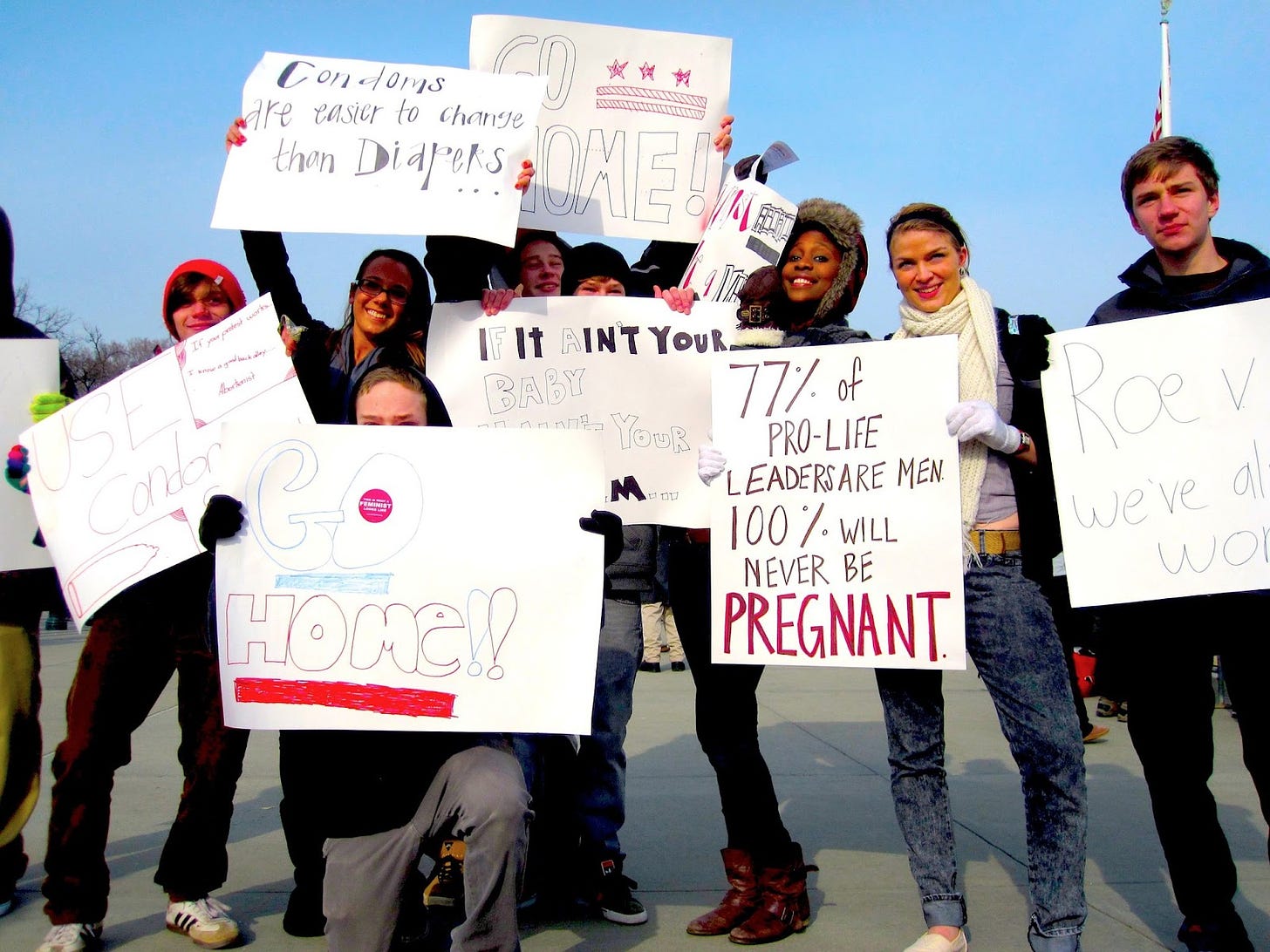 image of young kids holding pro-choice signs