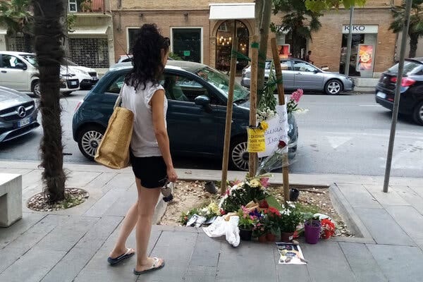 A memorial at the spot where Alika Ogorchukwu was killed in Civitanova Marche, Italy.