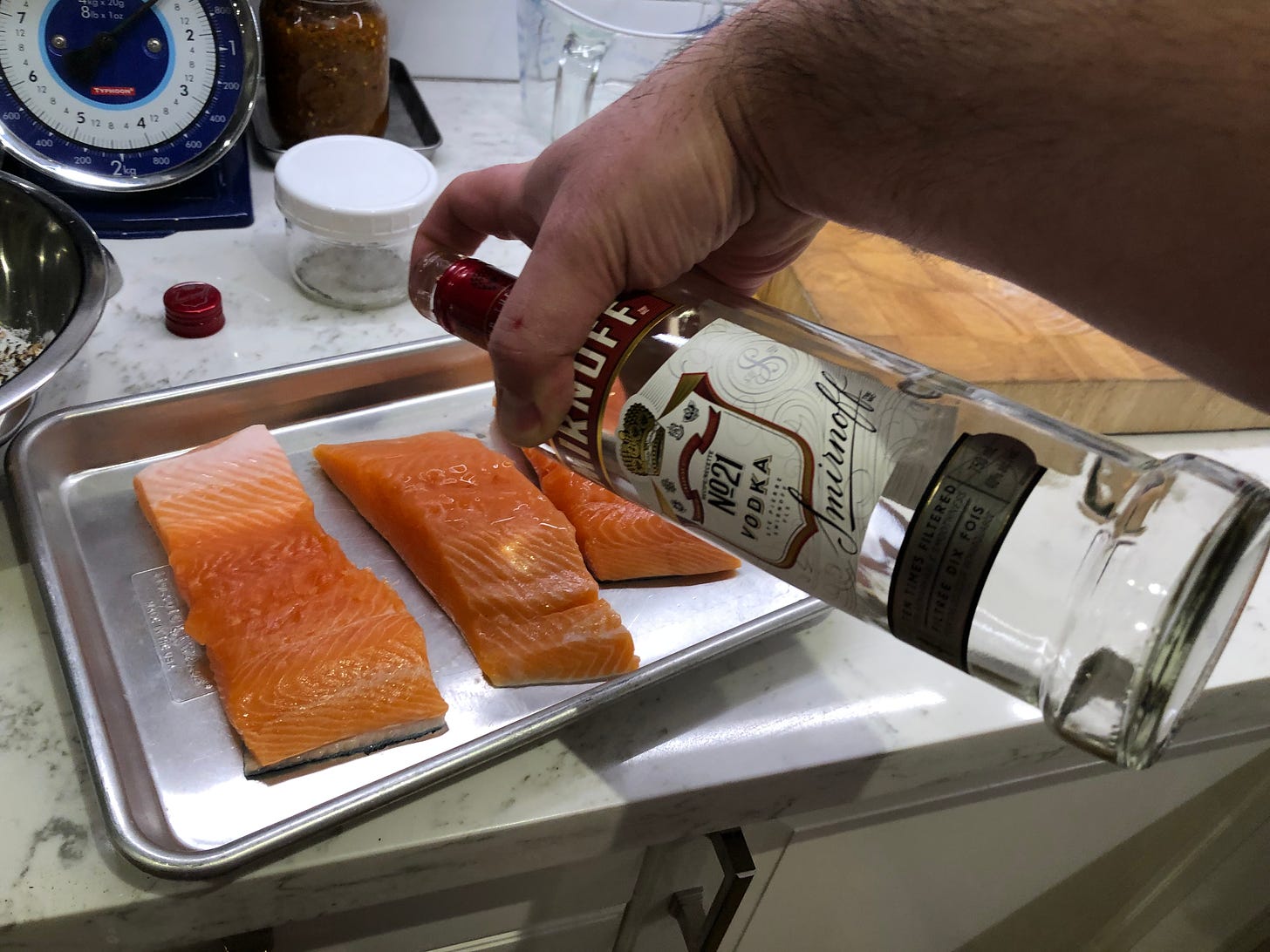 Splashing the salmon pieces with vodka