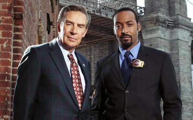 Lennie Briscoe and Ed Green, played by Jerry Orbach and Jesse L. Martin, long-running detective characters on Law & Order