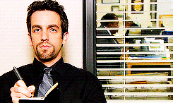 GIF of Ryan from "The Office" crossing something off his list in a notebook.
