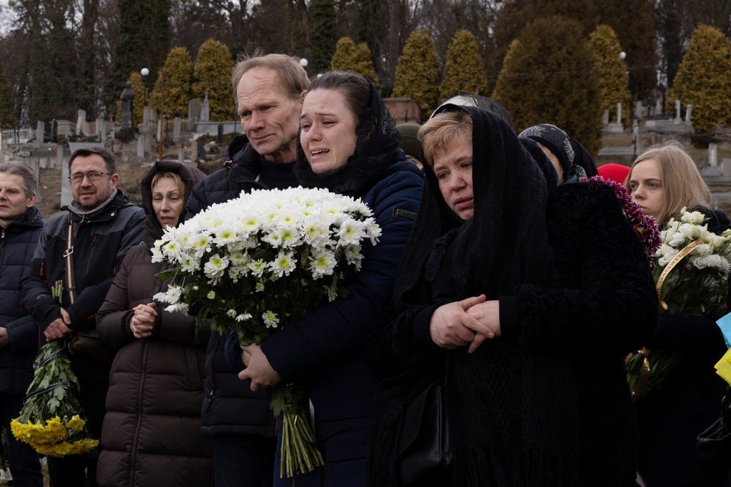 A joint funeral takes place at 'Saint's Peter and Paul Garrison Church', for two soldiers who died in the east of the country during recent fighting.