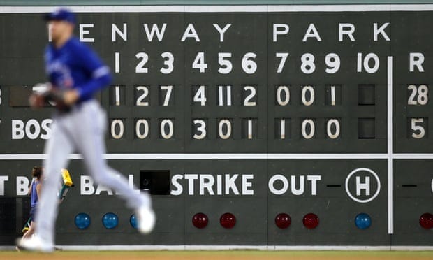 The Fenway Park scoreboard shows the damage.