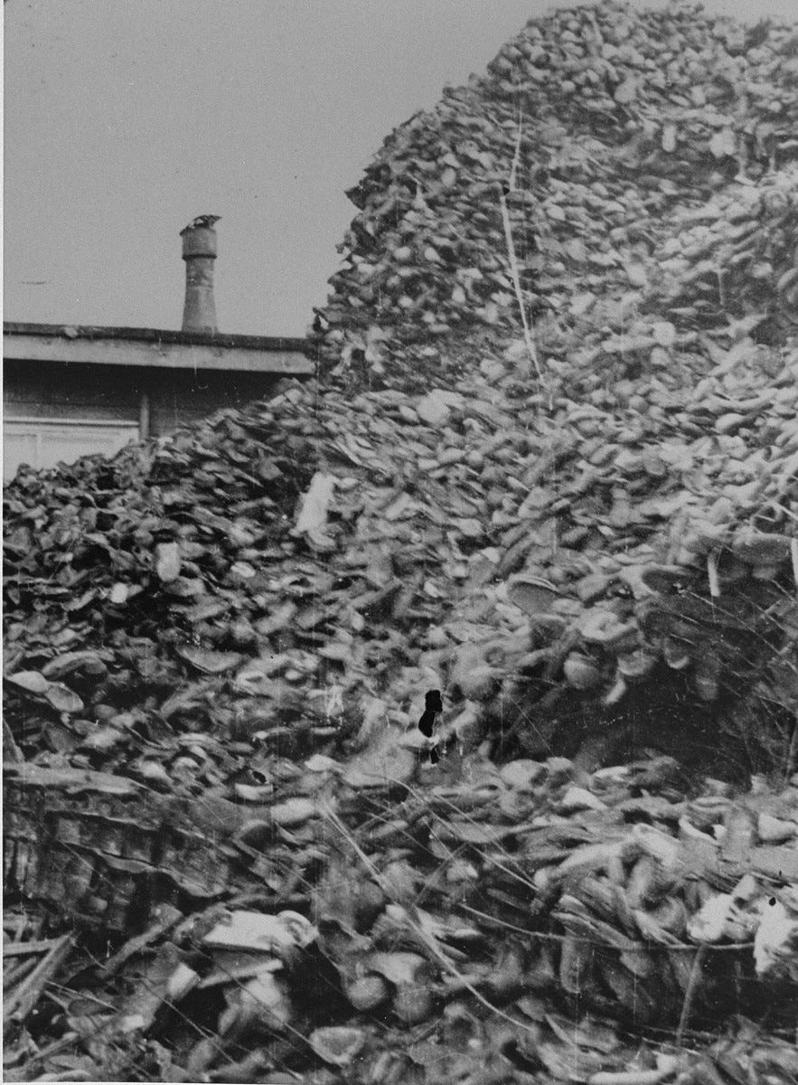 Piles of shoes stored in a warehouse in Auschwitz. - Collections Search -  United States Holocaust Memorial Museum