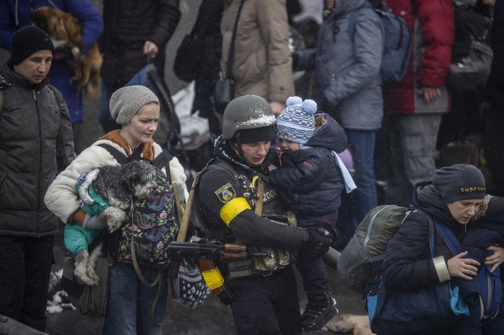 Civilians flee from Irpin due to ongoing Russian attacks in Irpin, Ukraine on March 08, 2022. 