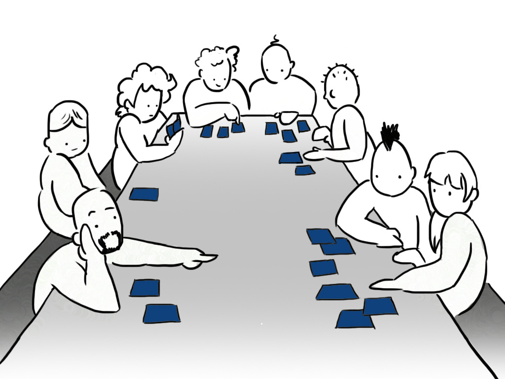 People sitting around the table of attention. Now more cards have someone focusing on them.