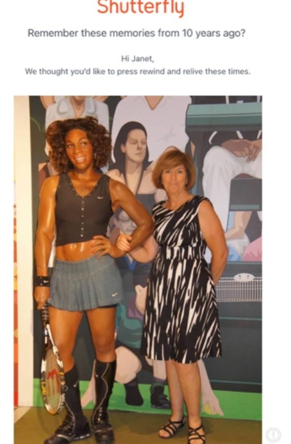 Woman standing with wax figure
