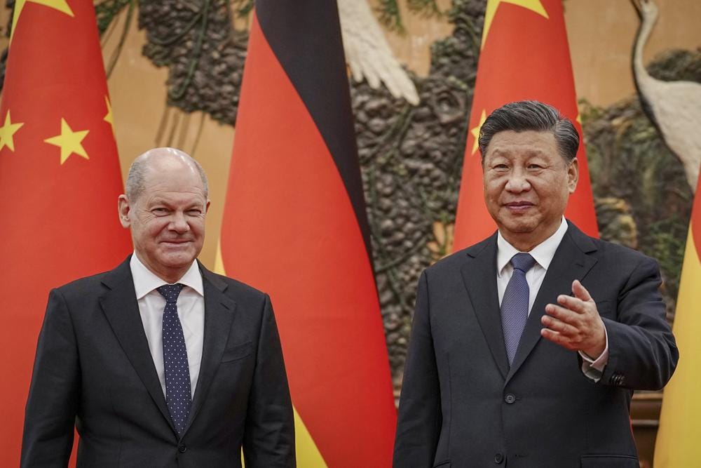 German Chancellor Olaf Scholz, left, meets Chinese President Xi Jinping at the Great Hall of People in Beijing, China, Friday, Nov. 4, 2022. (Kay Nietfeld/Pool Photo via AP)