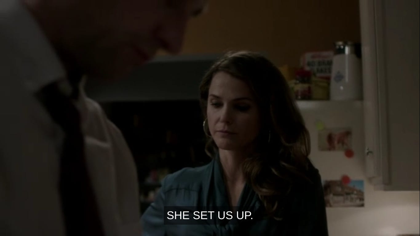 Elizabeth saying "She set us up" in the kitchen to Philip