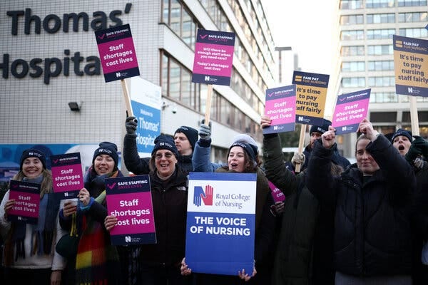 Nurses on a picket line outside a London hospital on Thursday. The strike comes as the N.H.S. is in crisis, with declining working conditions for clinical staff and amid the spillover pressures of the pandemic.