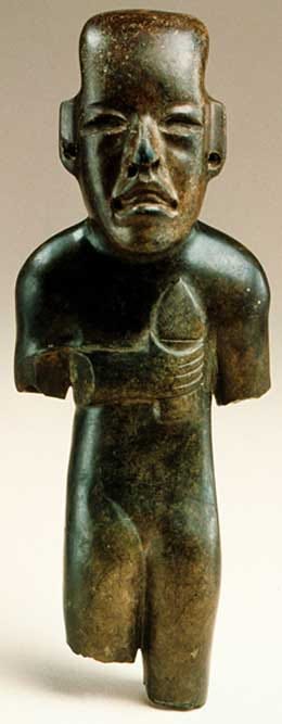 Sculpture of an Olmec child holding a torch.