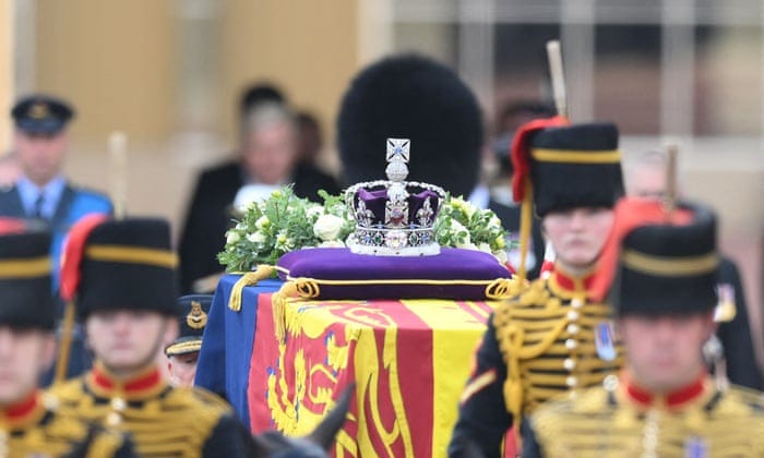 The coffin of Queen Elizabeth II, adorned with a Royal Standard and the Imperial State Crown.