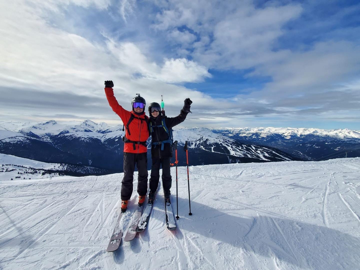 May be an image of 2 people, people standing, people skiing and nature