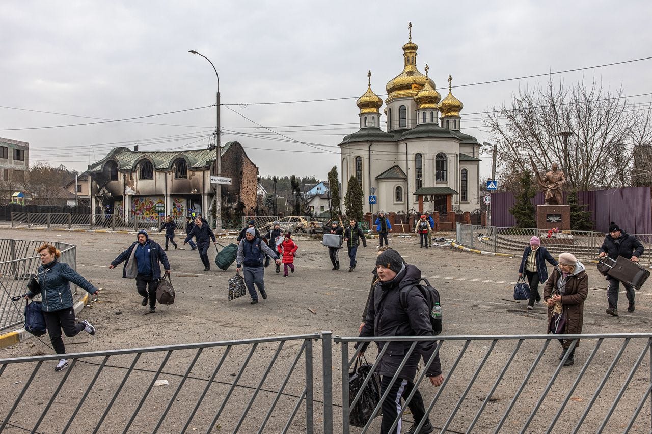 Residents fled from fighting in the town of Irpin, Ukraine, near the front line on the outskirts of Kyiv, on Monday. Residents fled from fighting in the town of Irpin, Ukraine, near the front line on the outskirts of Kyiv, on Monday.