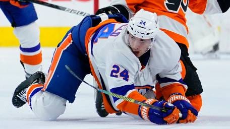The Flyers' Cam Atkinson, right, and the Islanders'