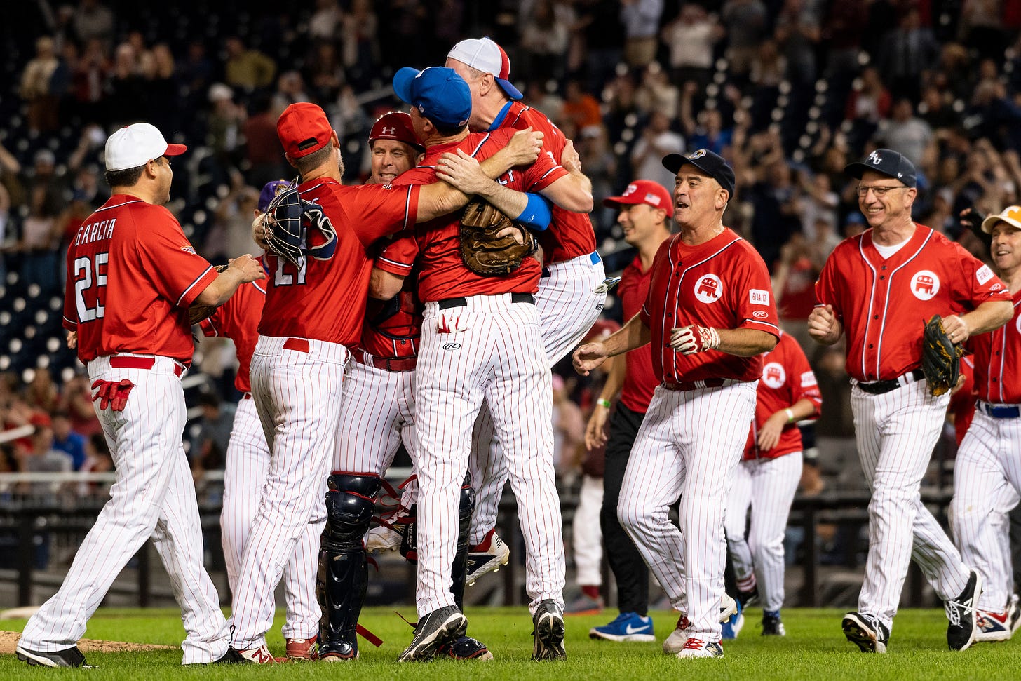 Republicans celebrate their win during last year’s Congressional Baseball Game. This year, “nonviolent” demonstrators have vowed to disrupt the game. (Bill Clark/CQ Roll Call file photo)