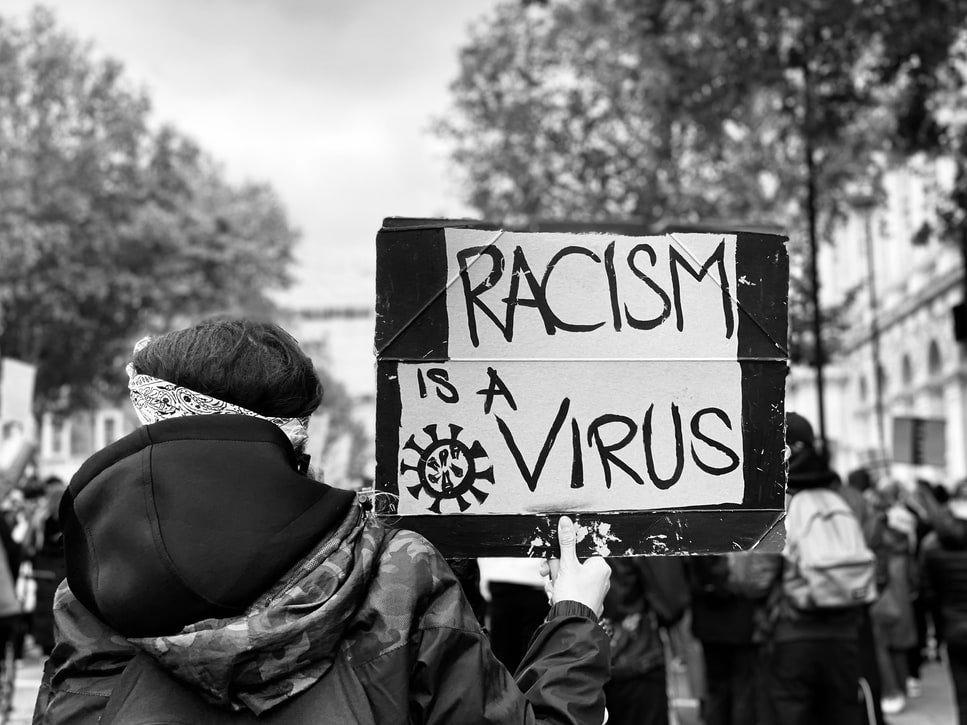 Racism is a virus. Black lives matter protest. Canadian racism