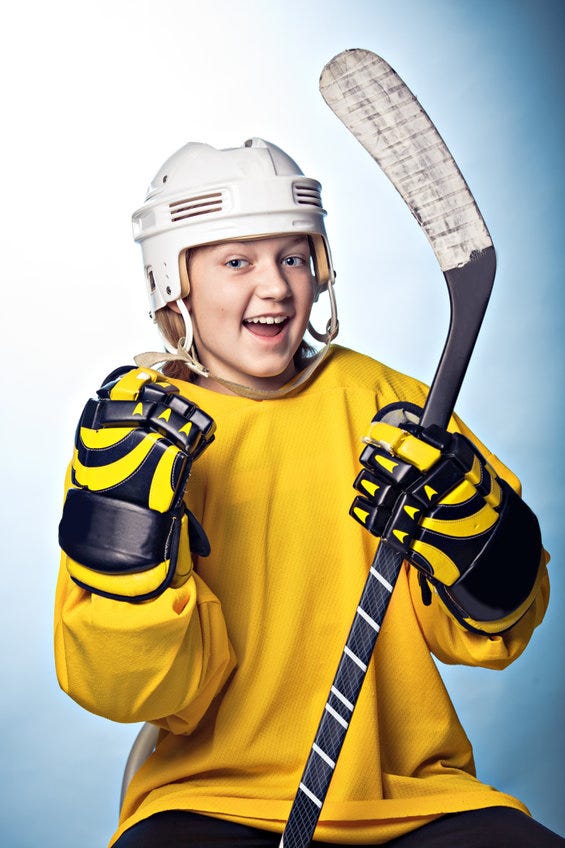 Teenage girl playing hockey