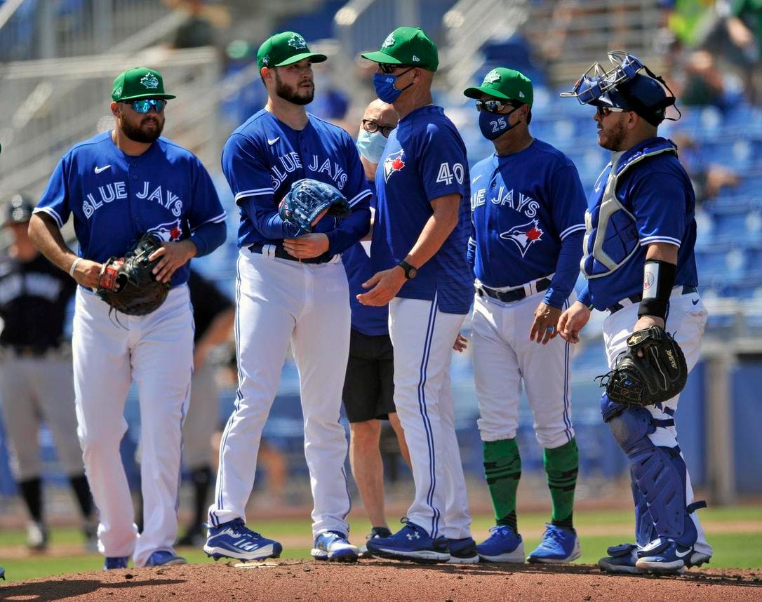 Blue Jays starter Thomas Hatch, second from left, left Wednesday’s game against the Yankees with what the club called “right elbow/forearm discomfort.”