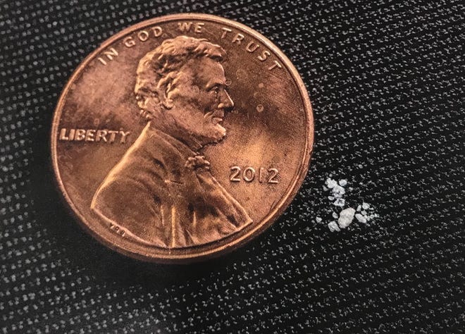 The fentanyl shown next to this penny is a lethal dose, according to federal agents.