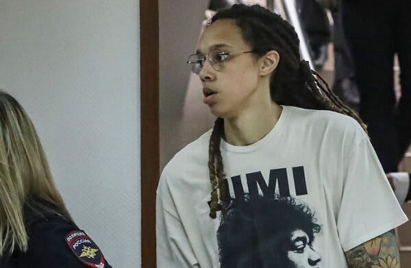 Brittney Griner, the W.N.B.A. star, being escorted to a courtroom outside Moscow on Friday. She said in a letter to President Biden on the Fourth of July that “freedom means something completely different to me this year.”