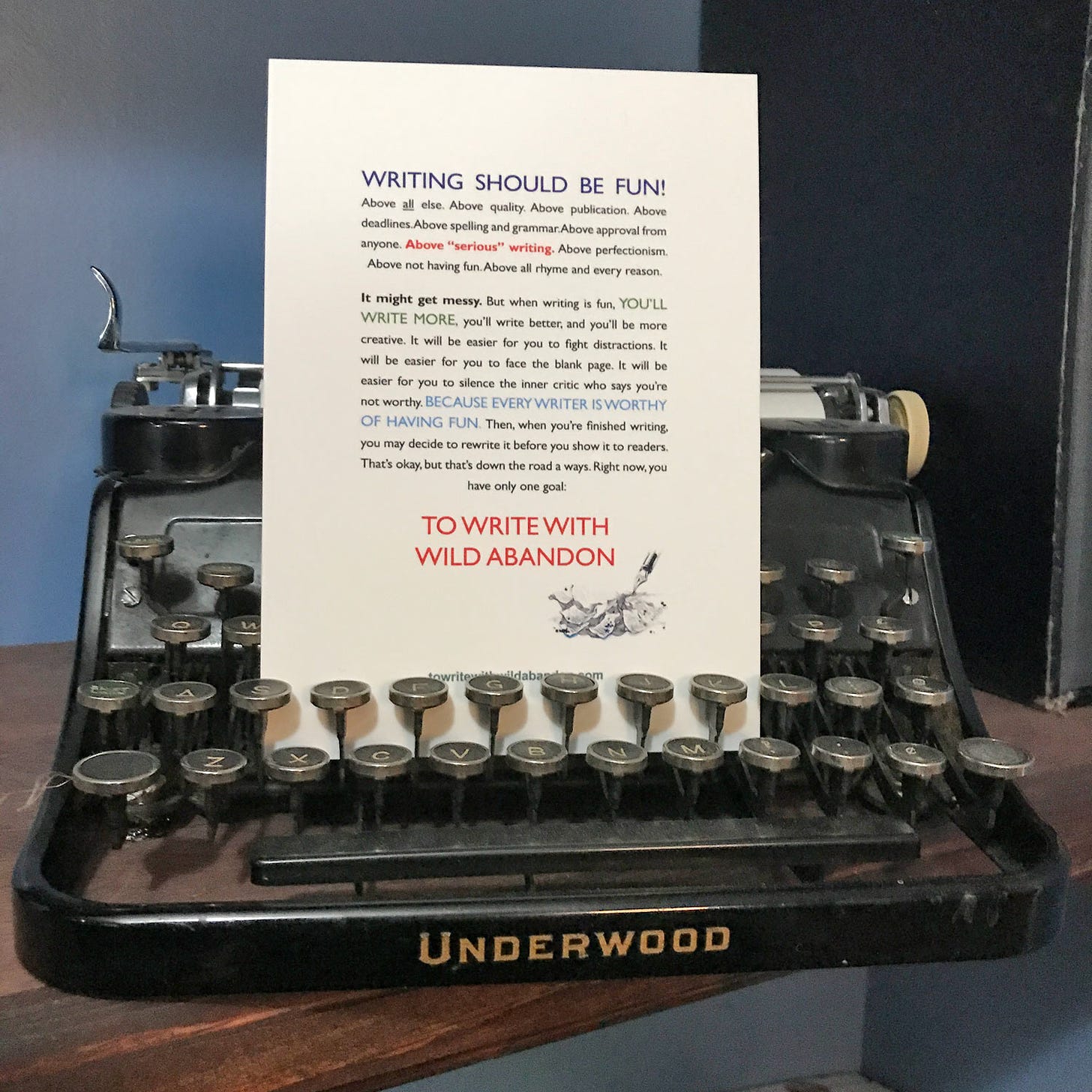 "To Write with Wild Abandon" postcard on an Underwood typewriter.