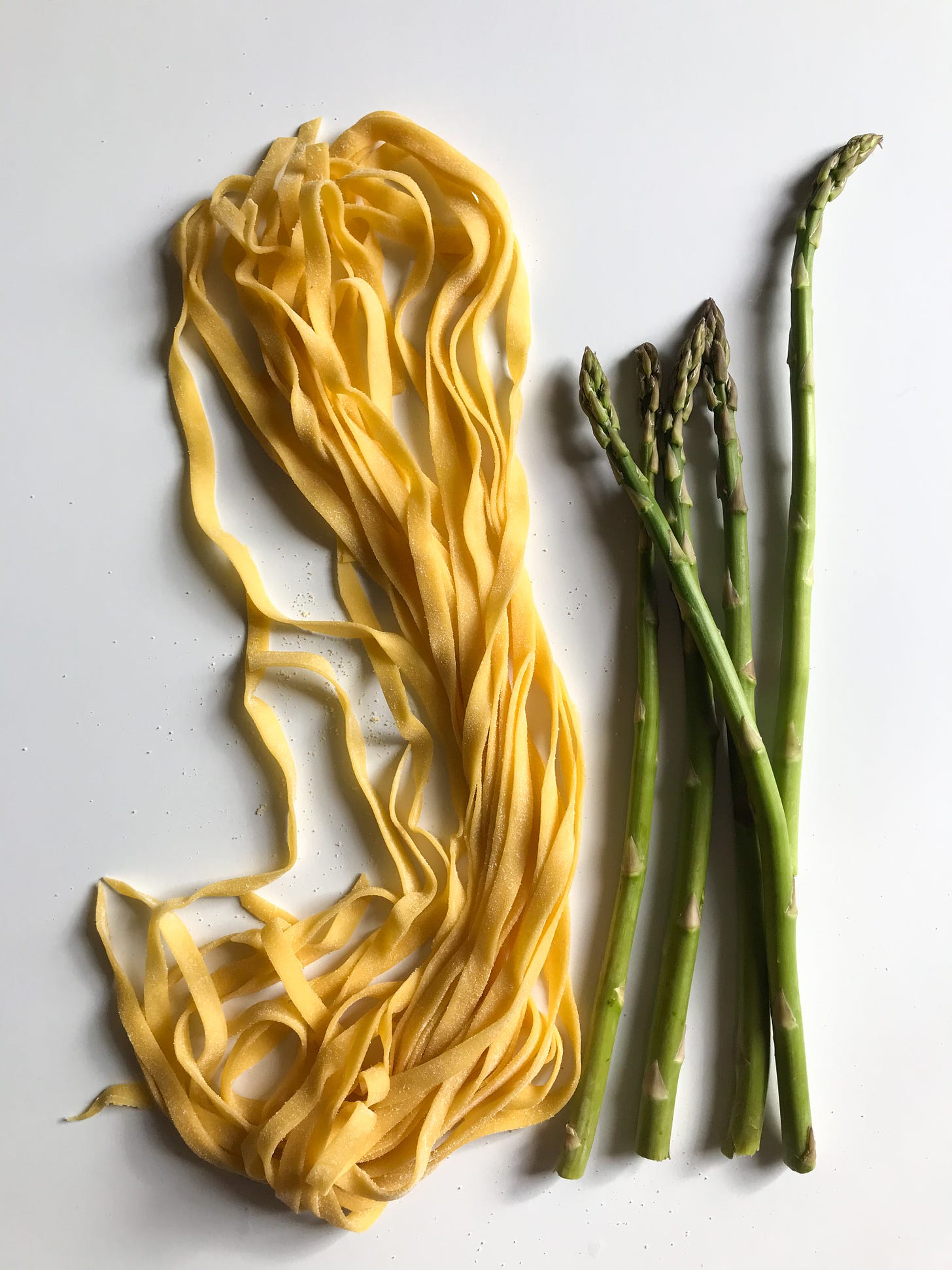 fresh pasta next to fresh asparagus