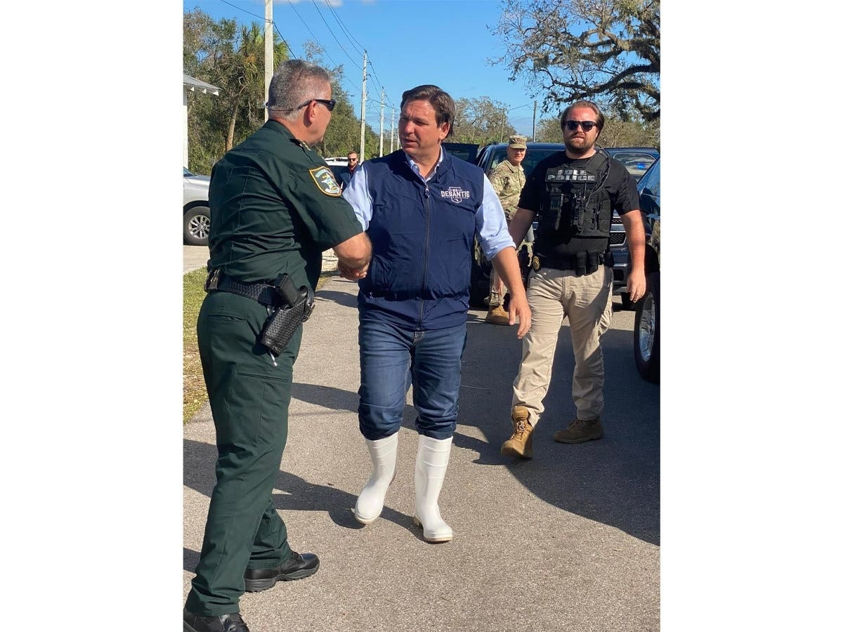 Florida Gov. Ron DeSantis speaks during a press conference to update residents about the ongoing efforts to help people after Hurricane Ian killed nearly 90 people. His choice of boots in disaster areas has late-night comics taunting the governor.