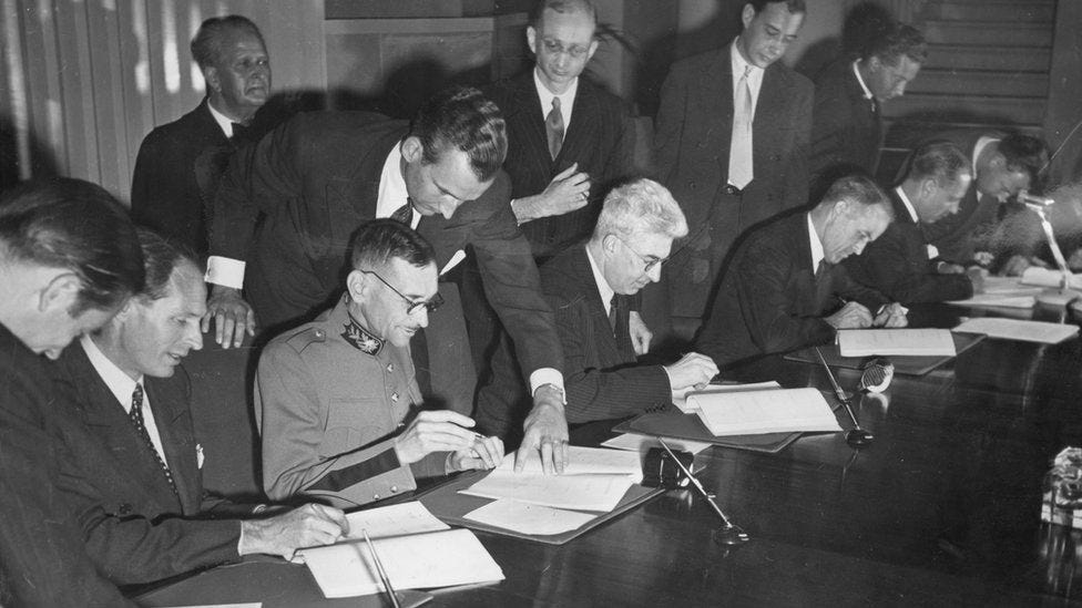 Signing the Geneva Convention in 1949