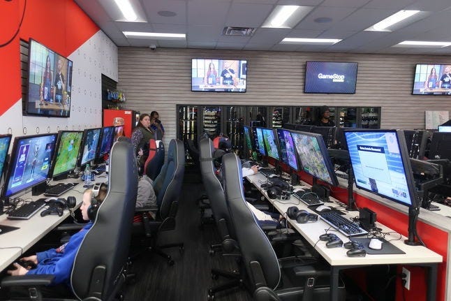 Just 12 of the 36 gaming stations set up at GameStop's social concept store, as the Fortnite tournament wound down for the night