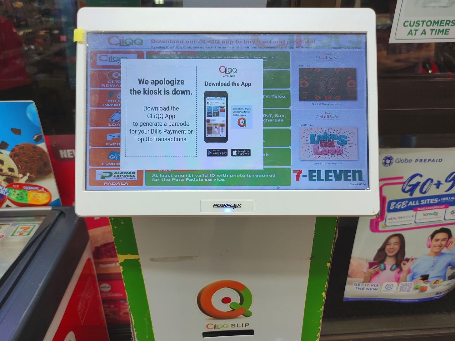 A standard CLiQQ kiosk found in 7-Eleven stores. The screen shows a warning: "We apologize the kiosk is down."