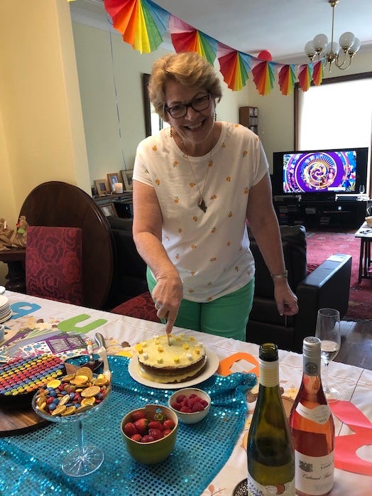 Jennifer cutting the pistachio and lemon cake at her rainbow party